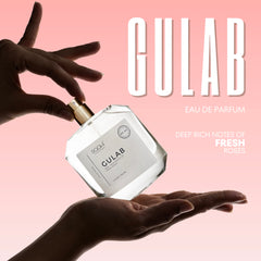 Clear glass bottle with gold-tone spray nozzle and minimalist white label of Gulab eau de parfum by Pooji