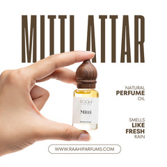 A small clear glass bottle with golden-yellow mitti attar perfume oil and a dark brown wooden cap handcrafted in kannauj