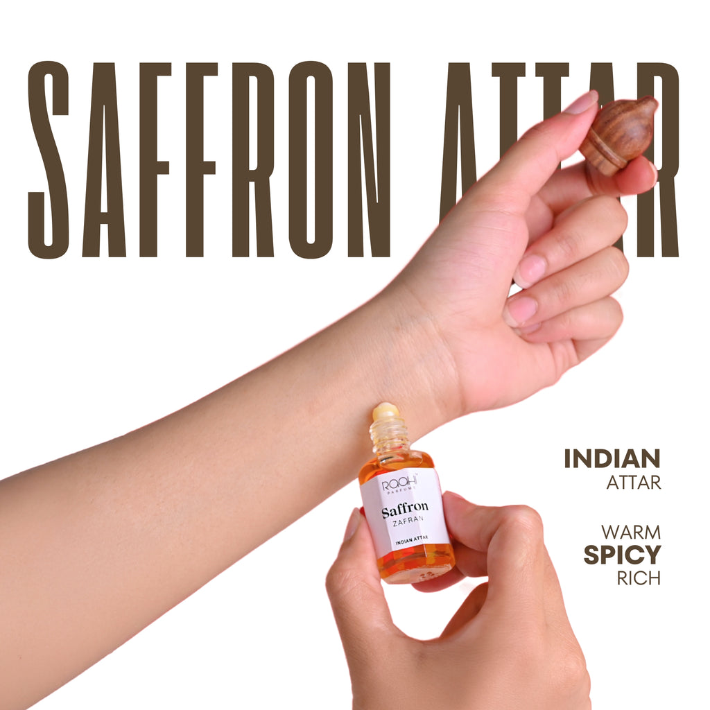 A small amber glass bottle of saffron attar by rooh with a white label and gold cap handcrafted in kannauj india